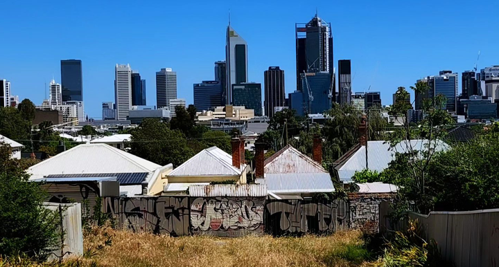 A city scape with a backdrop of a beautiful clear blue sky